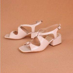ABOUT ARIANNE Brava white patent sandals.
